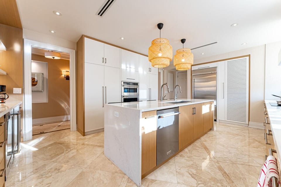 Modern, fully stocked kitchen with upscale touches.