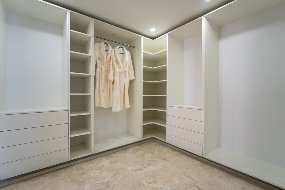 Primary bedroom walk-in closet