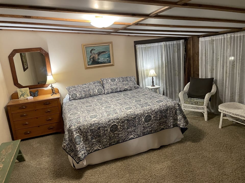 The Creekside Room. King bed with large windows overlooking the creek.