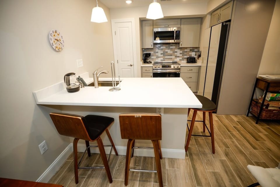 Kitchen island between kitchen and living room.