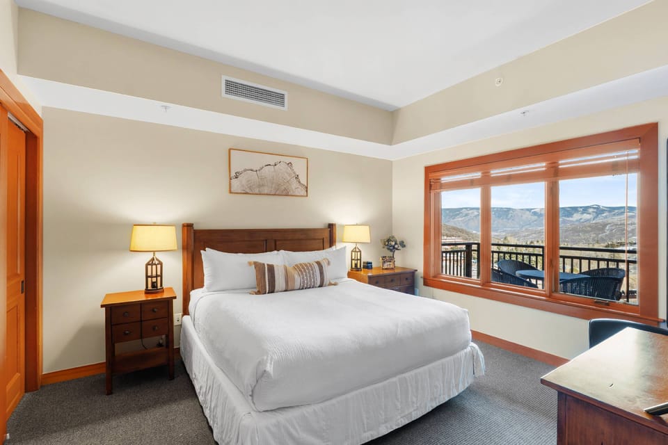 The master bedroom features a king bed, flat screen TV and en suite bathroom.
