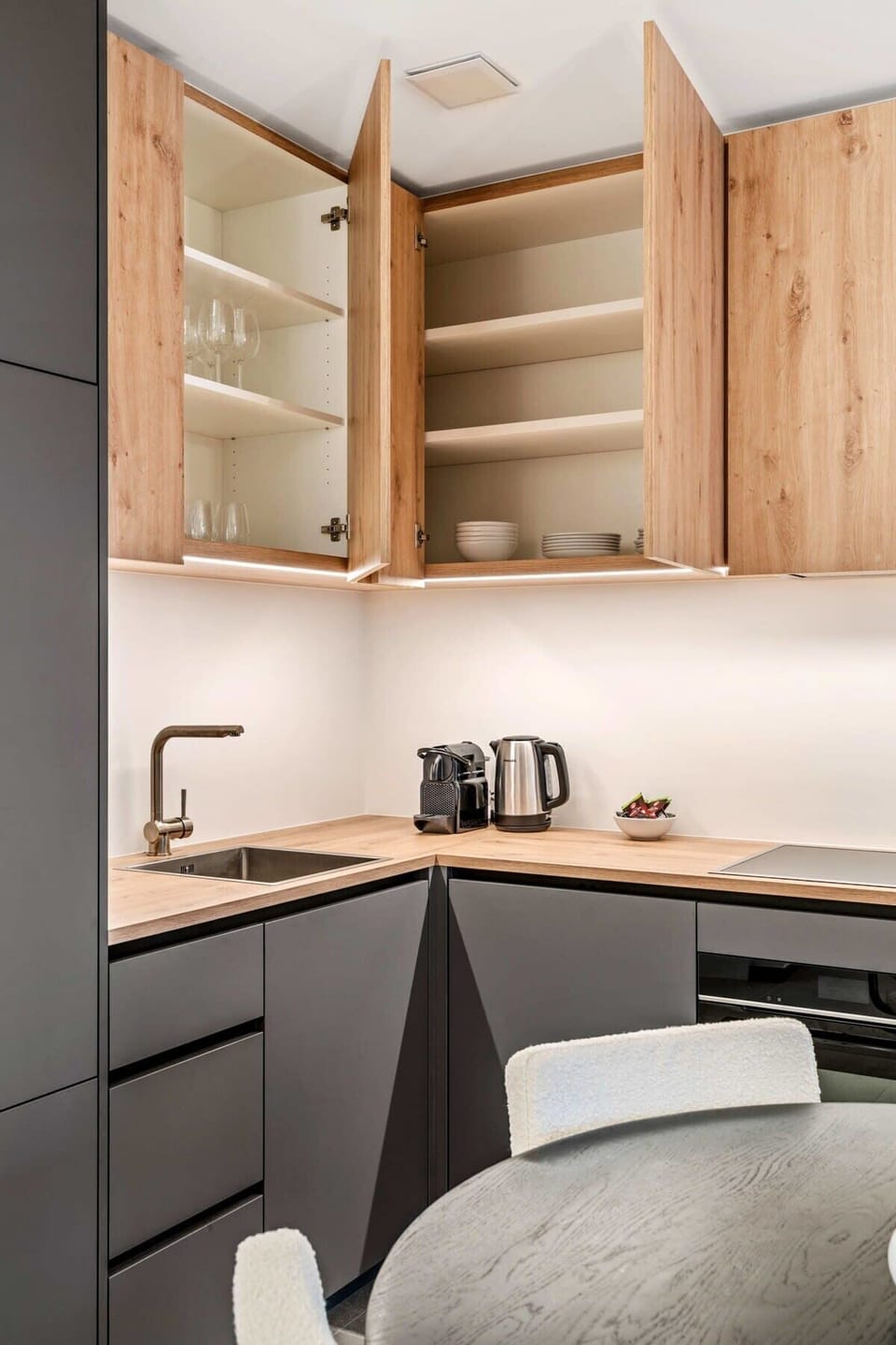 Whip up a snack or a feast in this fully-stocked kitchenette, where functionality meets sleek design.
