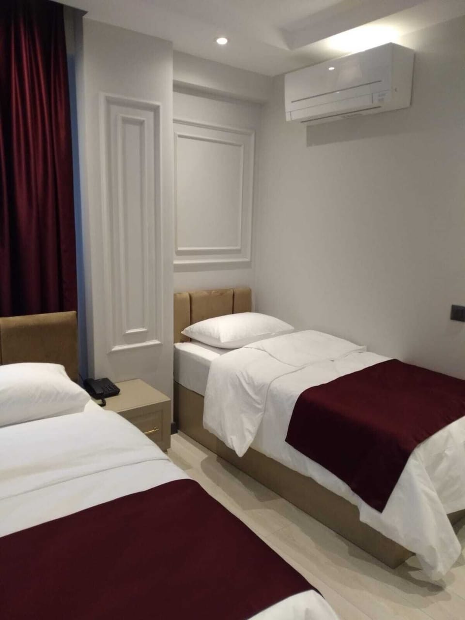 Standard Triple Room | Minibar, in-room safe, soundproofing, iron/ironing board