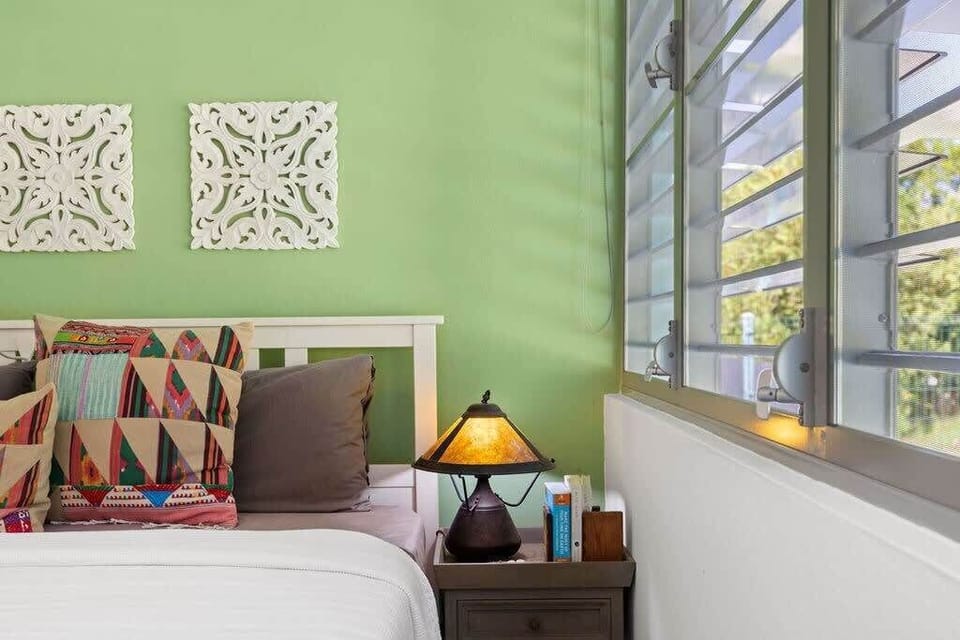 The master suite has a king-size bed, 2 personal nightstands, a walk-in closet, ceiling fan, AC, and an on-suite private bathroom.