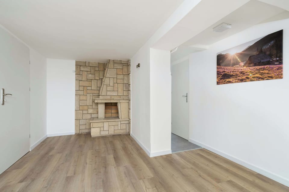 A close-up of the fireplace that adds warmth and character to the living room. It creates a cozy focal point, perfect for relaxing evenings.