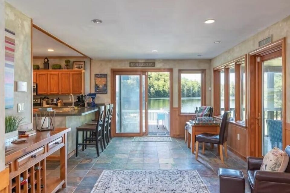 Entry opens into the kitchen, door to the deck and the sun room.