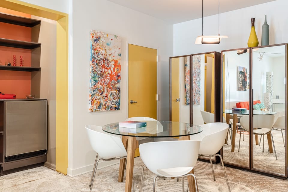 DINING TABLE FOR 4 NEXT TO LIVING AREA AND WET BAR