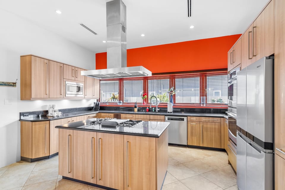 Vibrant pops of color are peppered throughout the kitchen