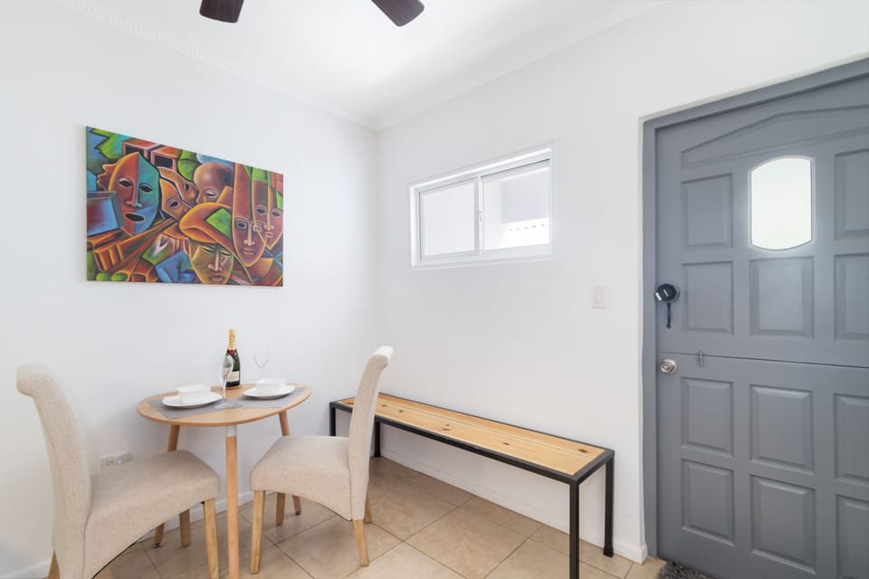 Chic Dining Area of the Apartment in Noord Aruba - Dining area for two - Quality materials, such as a sleek dining table and comfortable chairs - Harmonious color scheme for a cohesive and stylish look