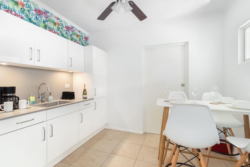 Chic Kitchen of the 2BR condo in Noord Aruba - Fully Equipped - Smart use of space with versatile storage solutions -  A kitchen that seamlessly combines style, functionality, and convenience