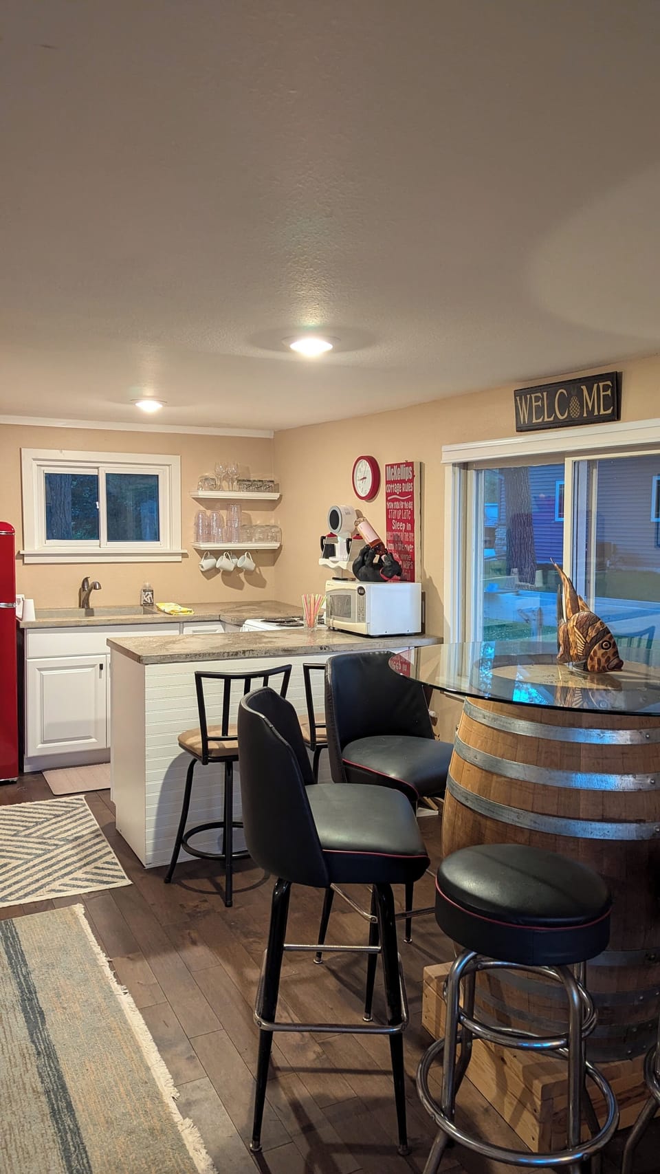 The kitchen table and the breakfast bar.