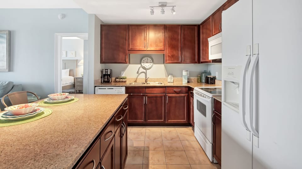 Modern kitchen with dark wood cabinets and a spacious island for family cooking.