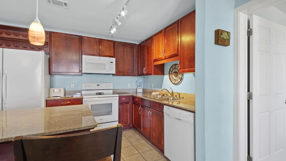 kitchen with wooden cabinets and modern appliances for convenient cooking