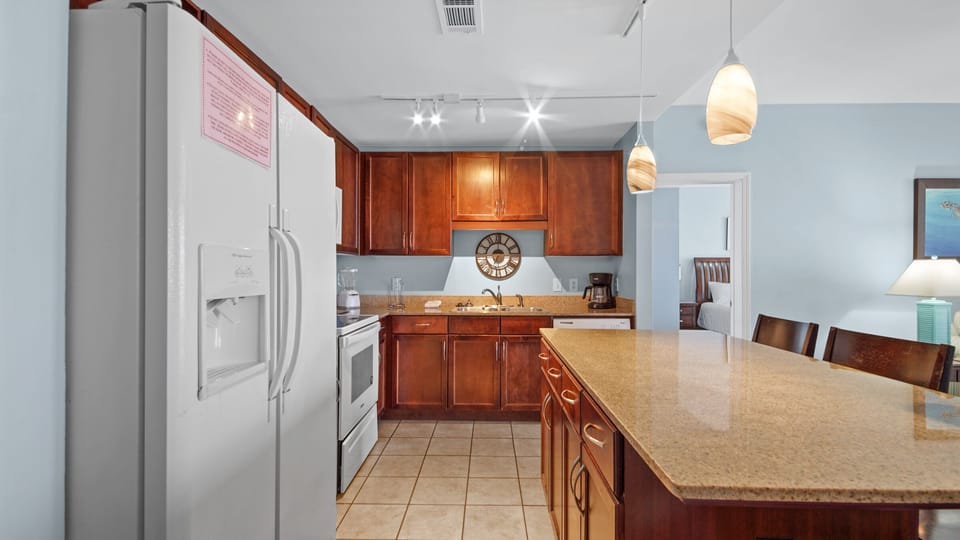 Modern kitchen with wooden cabinetry and a large island for family gatherings