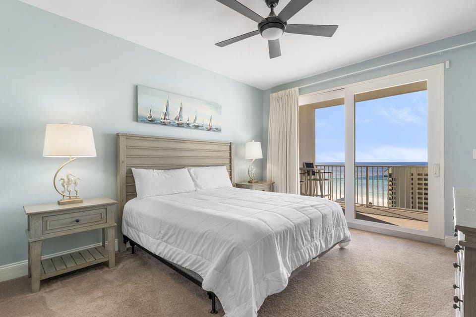 Relax in this modern bedroom with ocean views from the balcony.