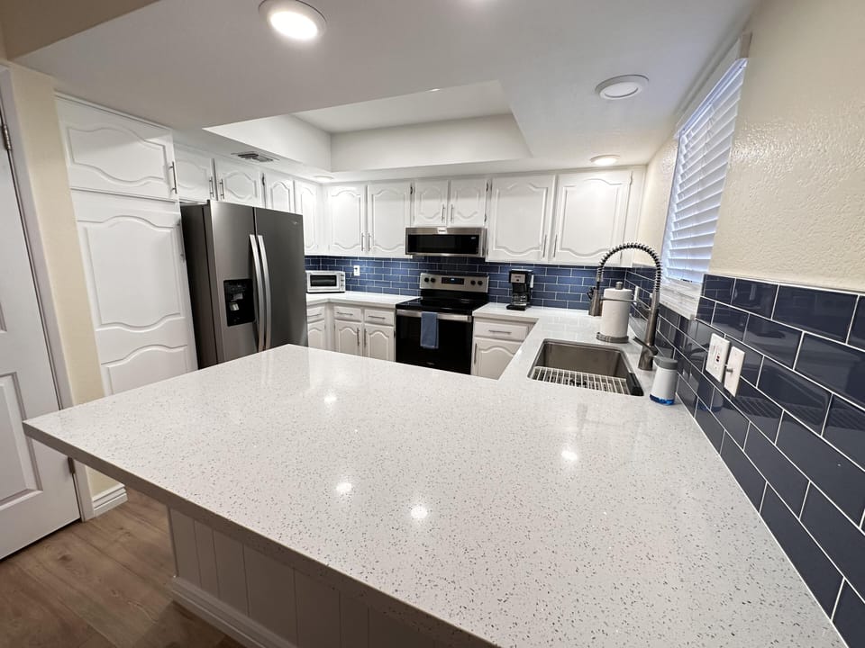 Kitchen has lots of counter space and storage.