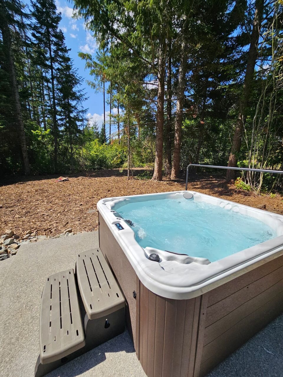 You will have your own private hot tub surrounded by trees, stars and lights at night.