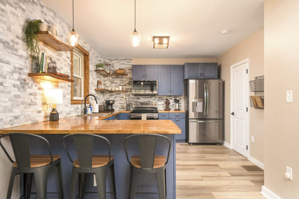 With an open layout and island seating, the kitchen is perfect for morning chats, shared cooking, and staying part of the action.