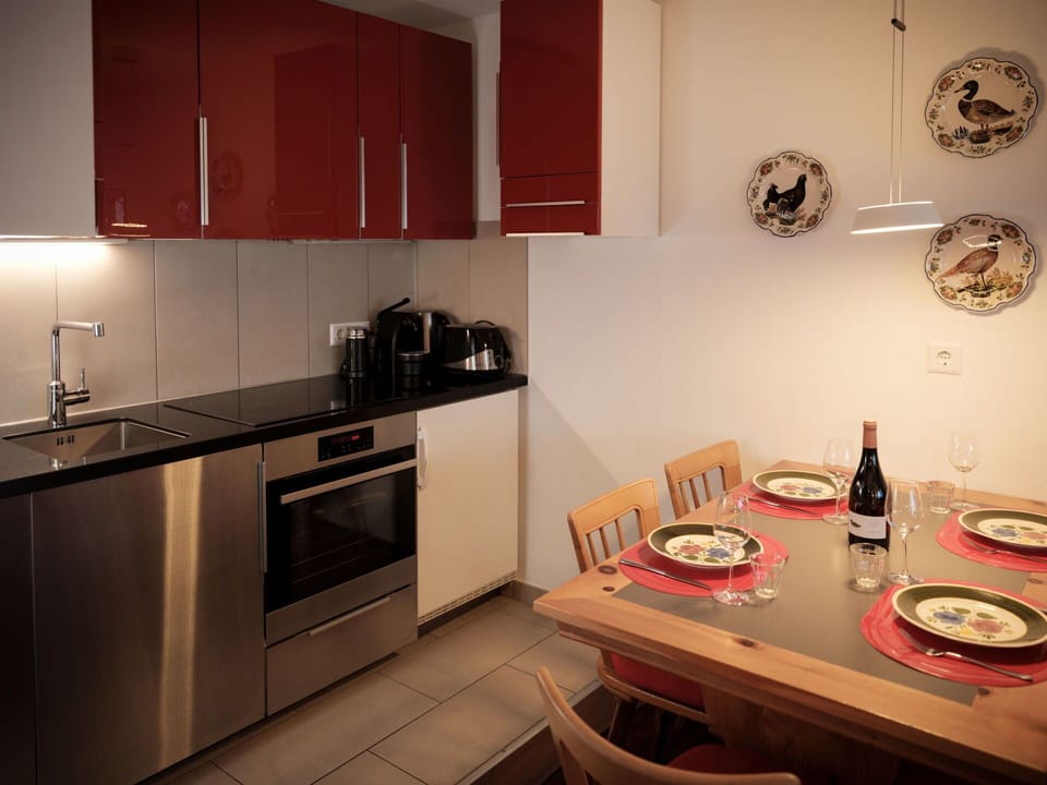 Cabinetry, Property, Countertop, Table, Kitchen Appliance, Kitchen Stove, Kitchen, Wood, Interior Design, Home Appliance