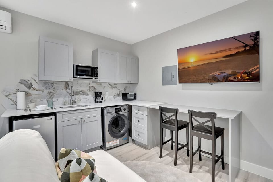 Small space, big convenience: Having your laundry right in the kitchen saves time and steps.