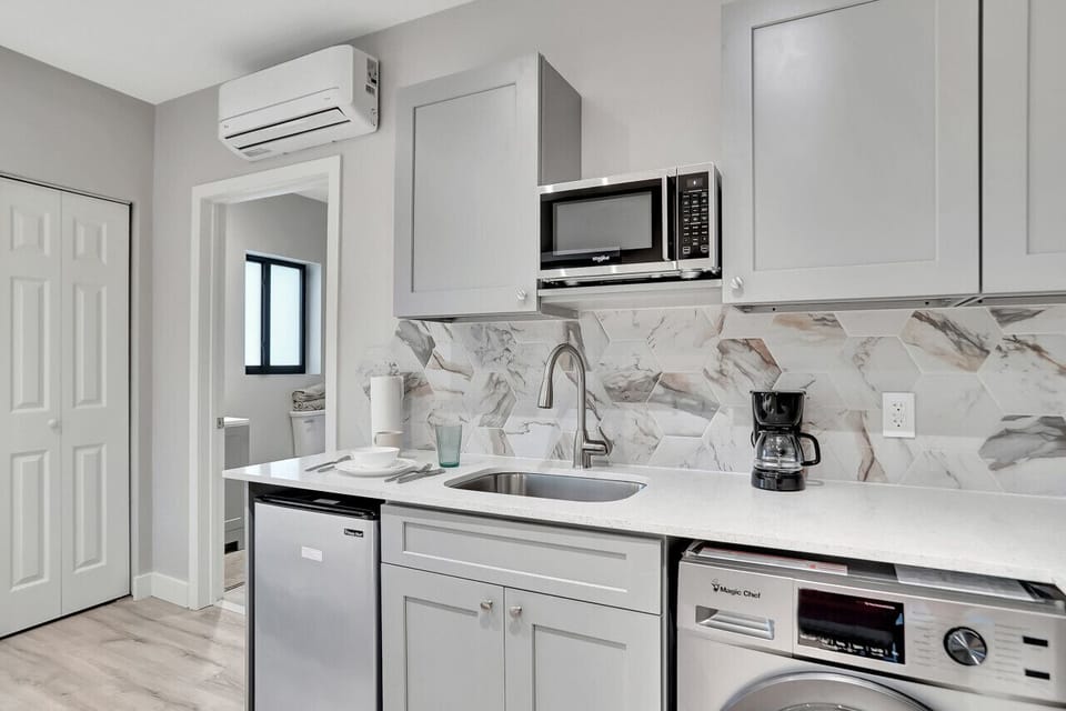 Stainless steel and sunshine: This sleek kitchen is built for busy mornings and cozy evenings.