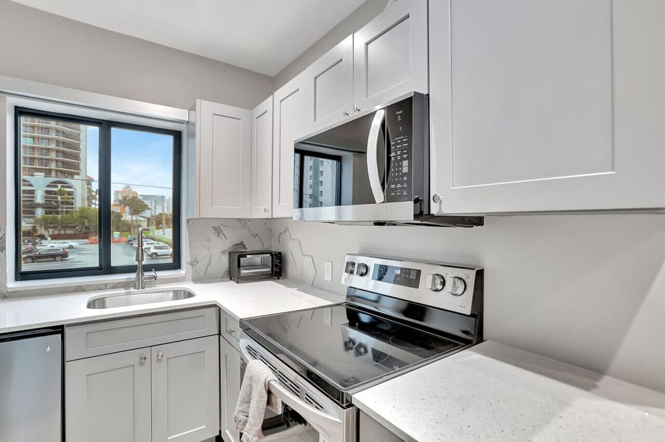 Coffee, dishes, and deadlines: This kitchen is the hub of the home, where mornings buzz and memories are made.