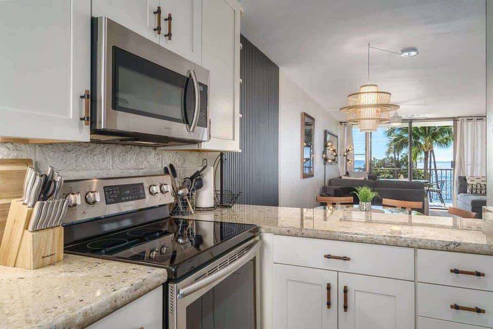 Our sleek and well-stocked kitchen makes cooking a breeze, with a hint of the beautiful ocean just beyond. 