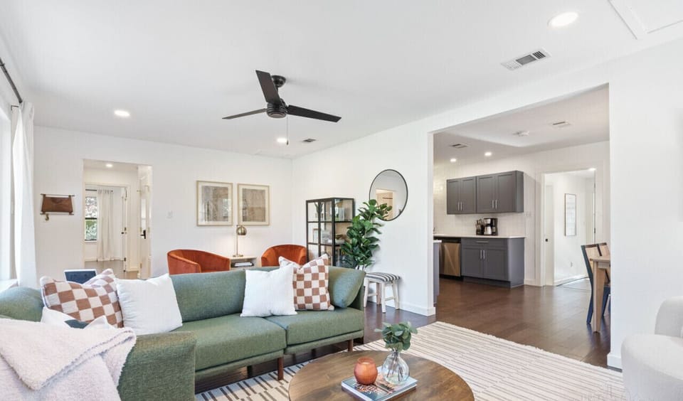 Beautifully decorated living room with endless seating and smart tv