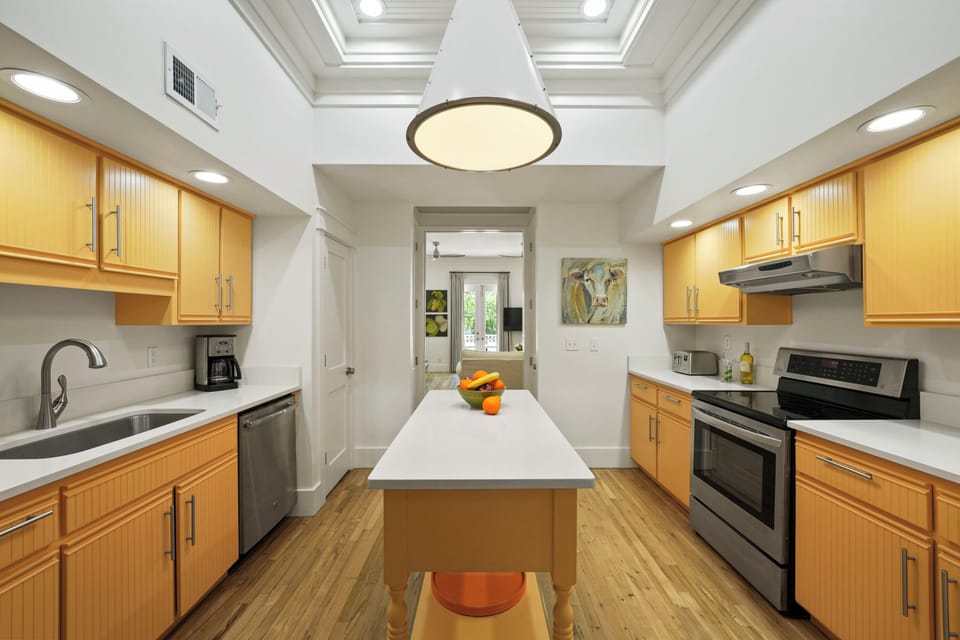 RENOVATED KITCHEN BETWEEN DINING & REAR PRIMARY LIVING