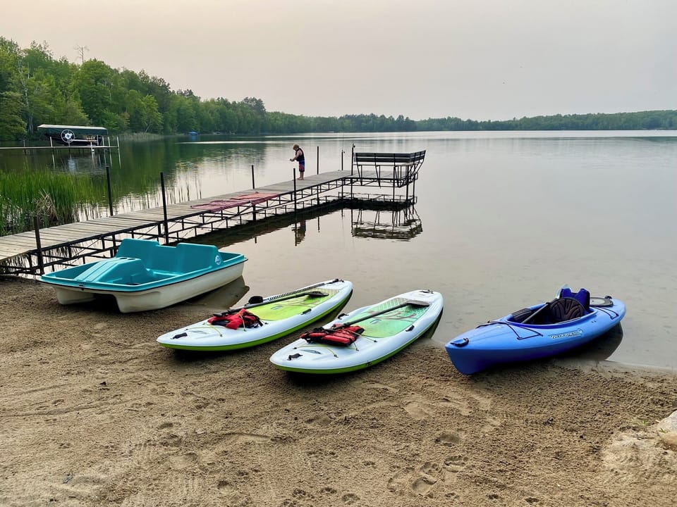 Private sand beach with a shallow swimming area.