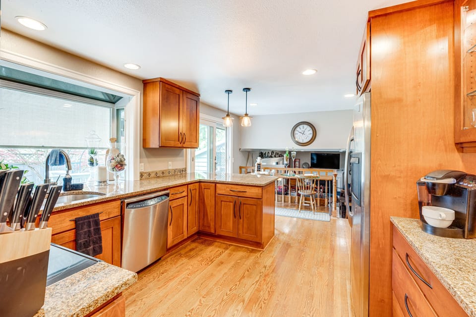 View of the kitchen looking towards the patio slider and lower family room area