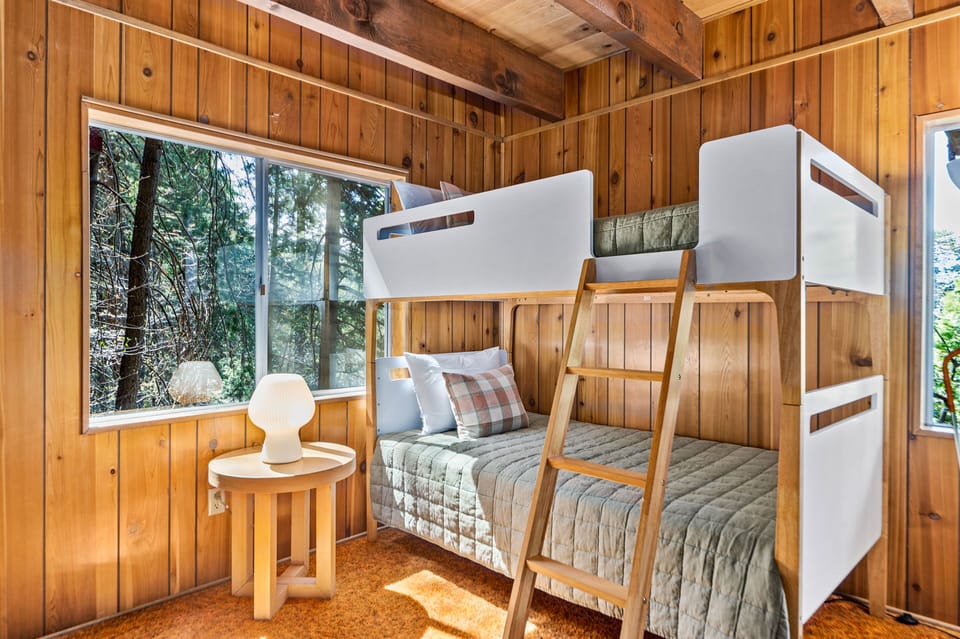 Two twin size beds with 100% cotton organic bed sheets provide cool comfort