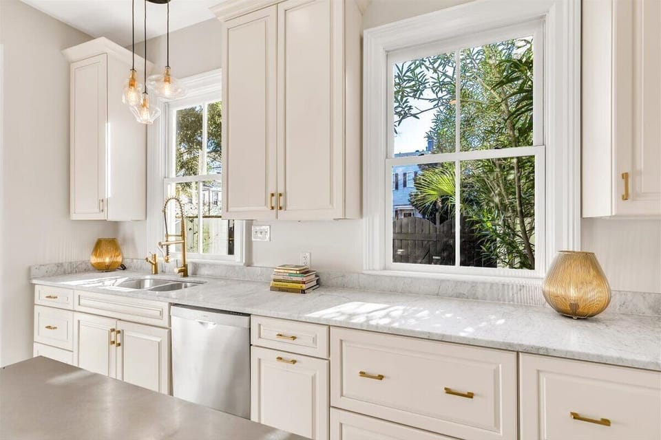 Kitchen with two light filled windows and views of private courtyard