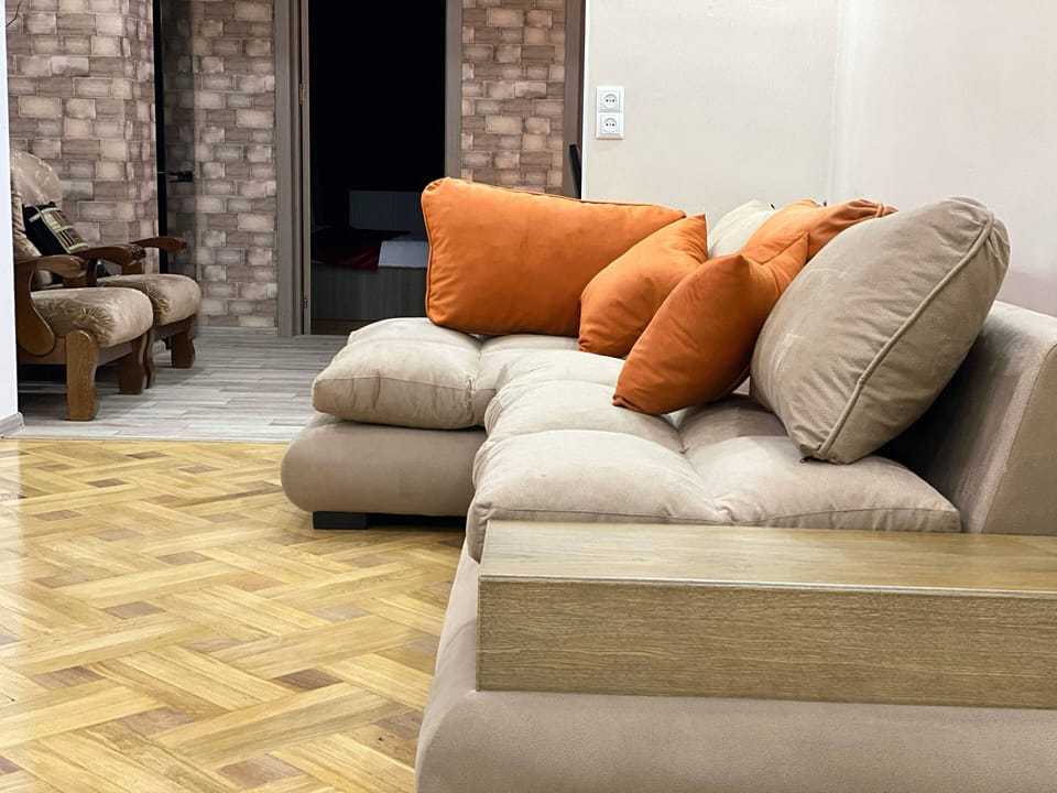 Deluxe Apartment, 4 Bedrooms | Living area | Flat-screen TV