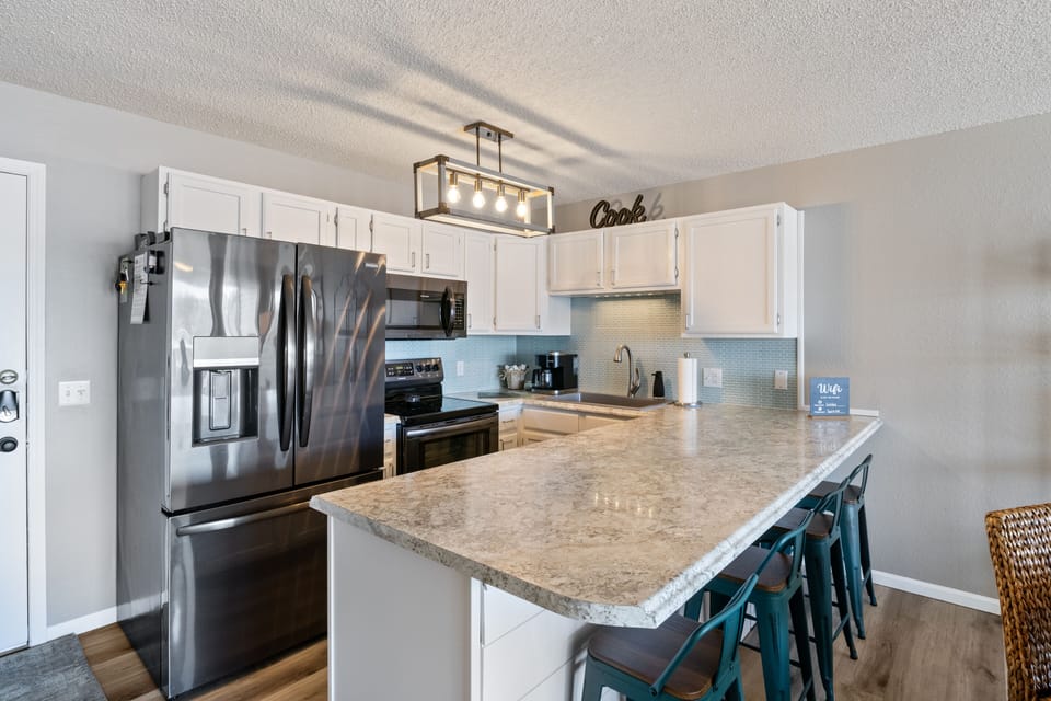 New stainless steel appliances and everything you need to prepare meals.