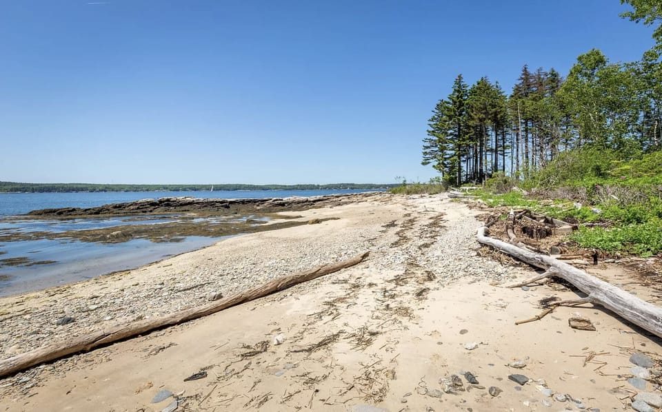 Private beach standing near house looking north.