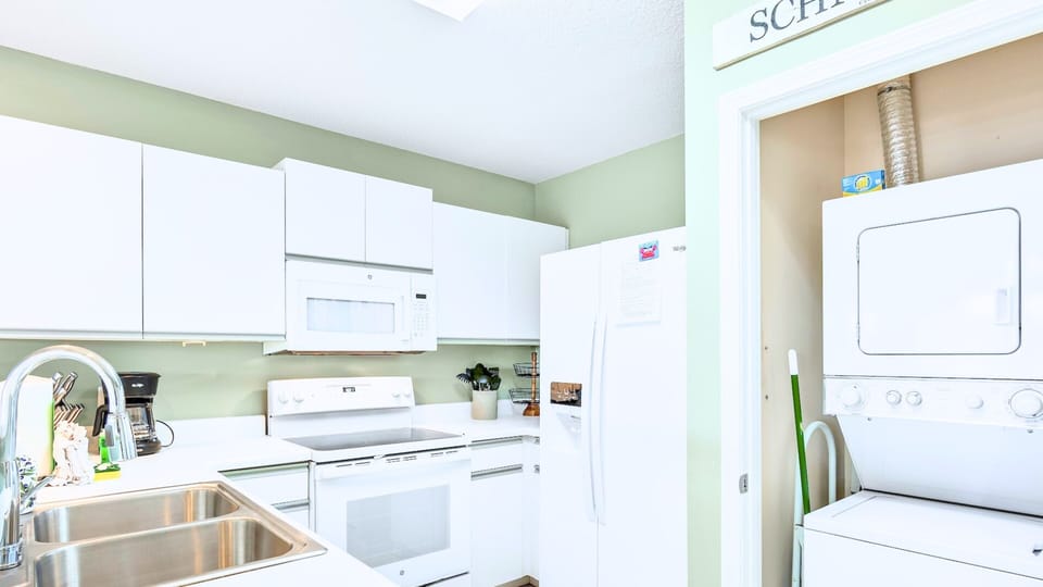 A bright kitchen with full appliances and in-unit laundry.
