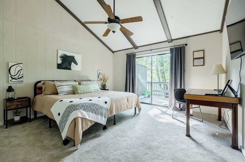 Bedroom Two: Bright and airy space with a serene view and stylish decor for ultimate relaxation!