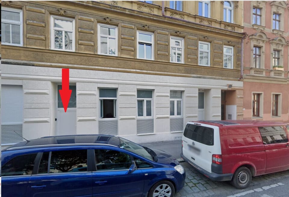 House and entry door of the flat below arrow