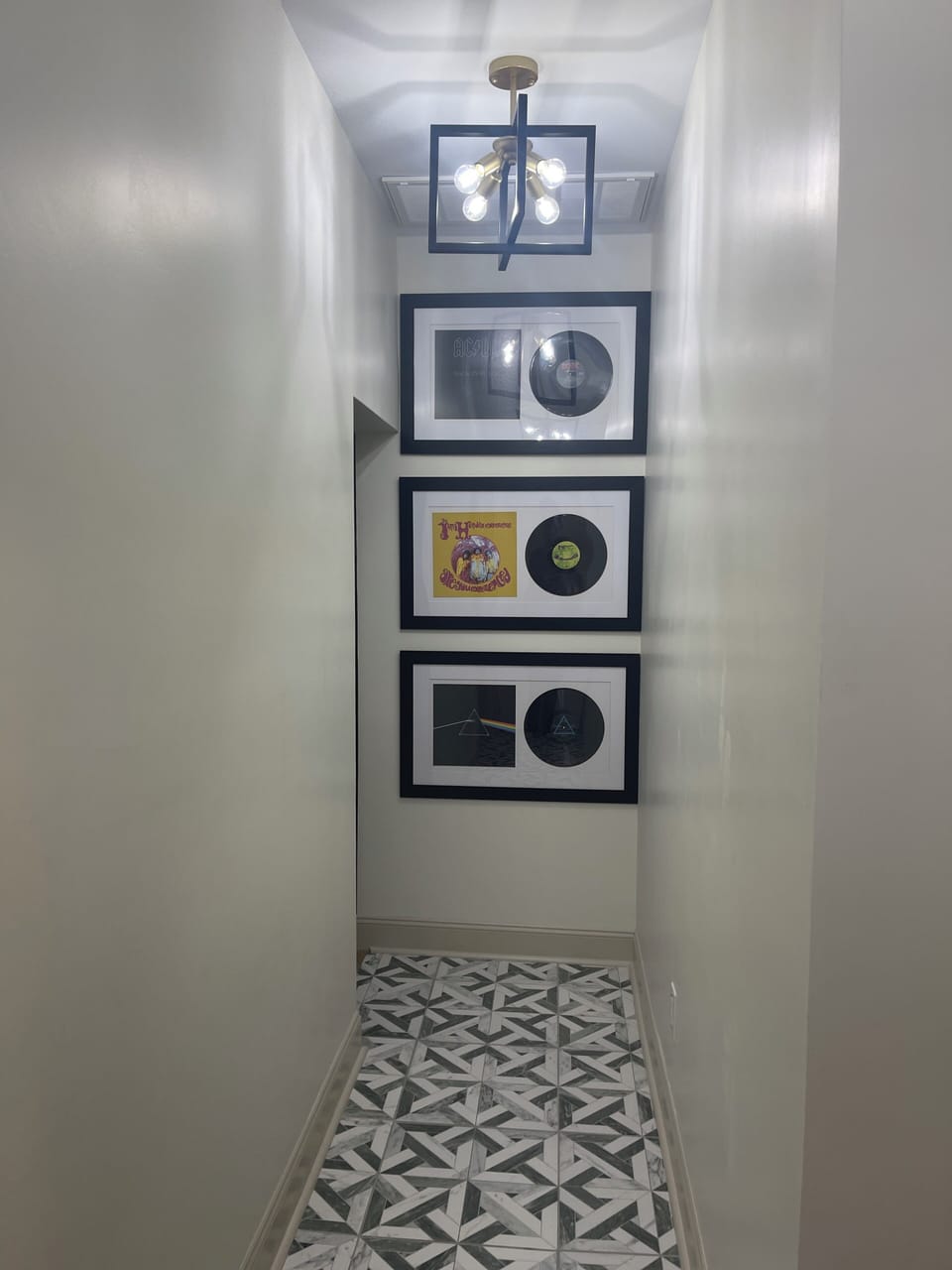 Hallway to laundry room, bedroom 3 (The Zendaya) and backdoor 