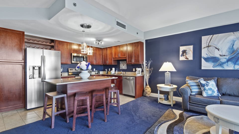 Modern kitchen with wooden cabinetry and a central island for casual dining