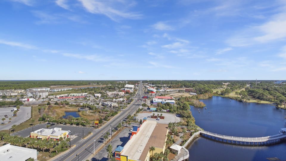 View of a commercial area alongside a waterway under a clear sky