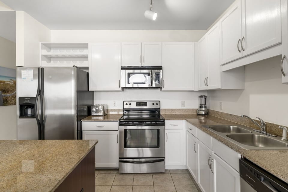 Modern kitchen with stainless steel appliances and ample counter space