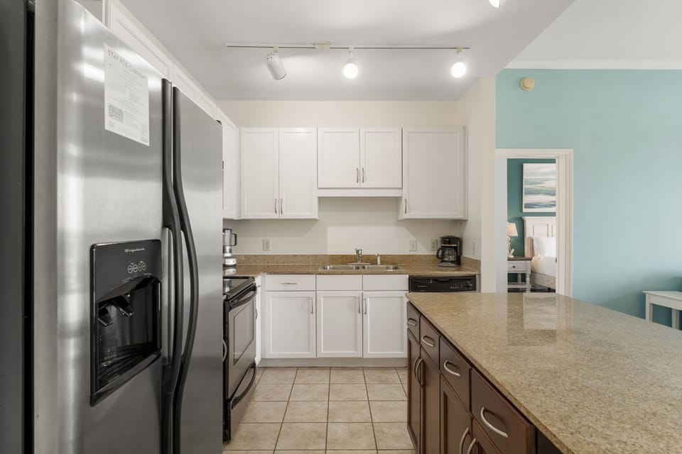 Modern kitchen with stainless steel appliances and a spacious island.