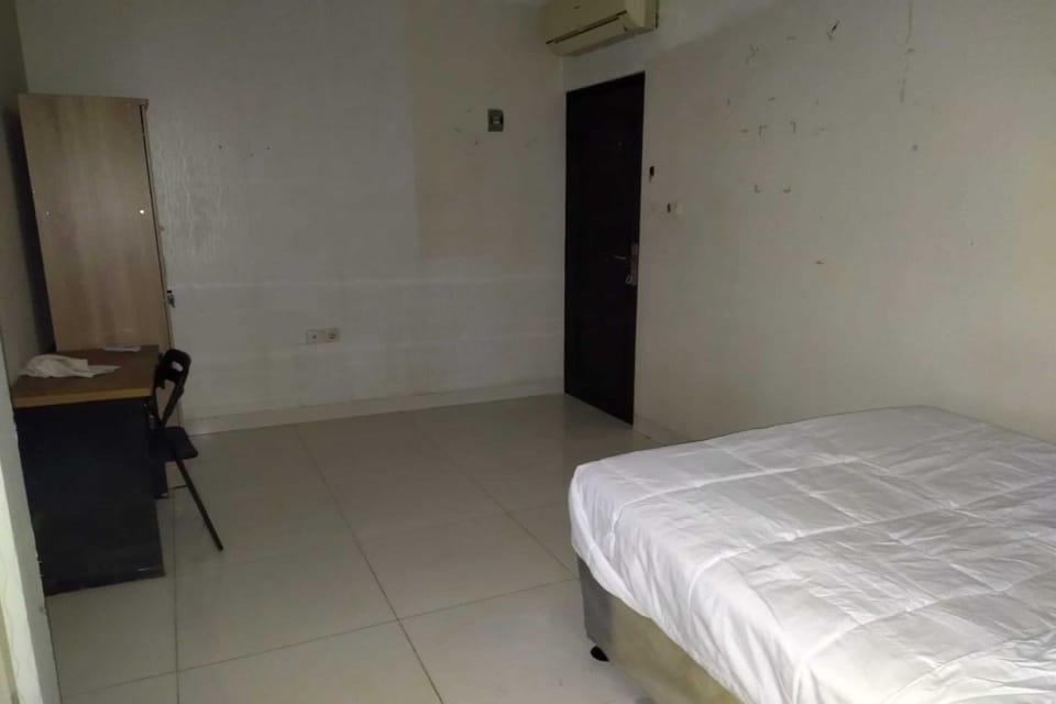 Desk, laptop workspace, bed sheets