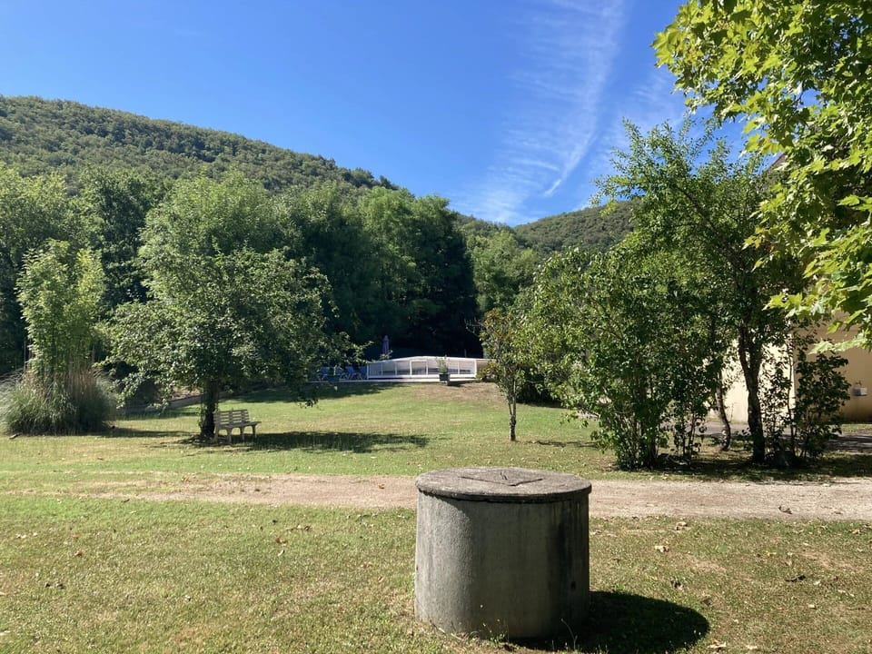 View of pool with well in foreground