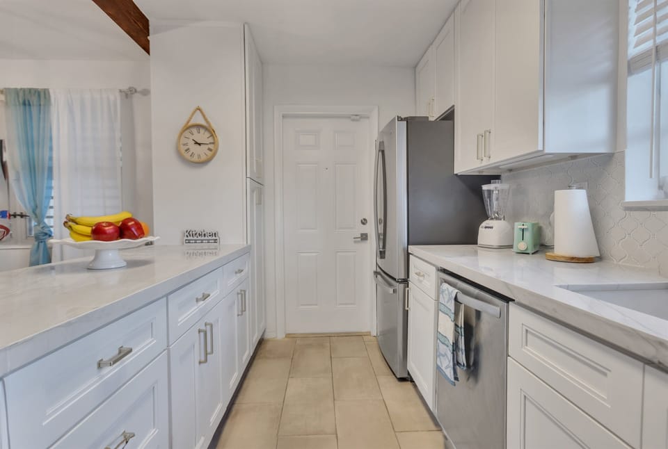 Kitchen, entryway from carport.