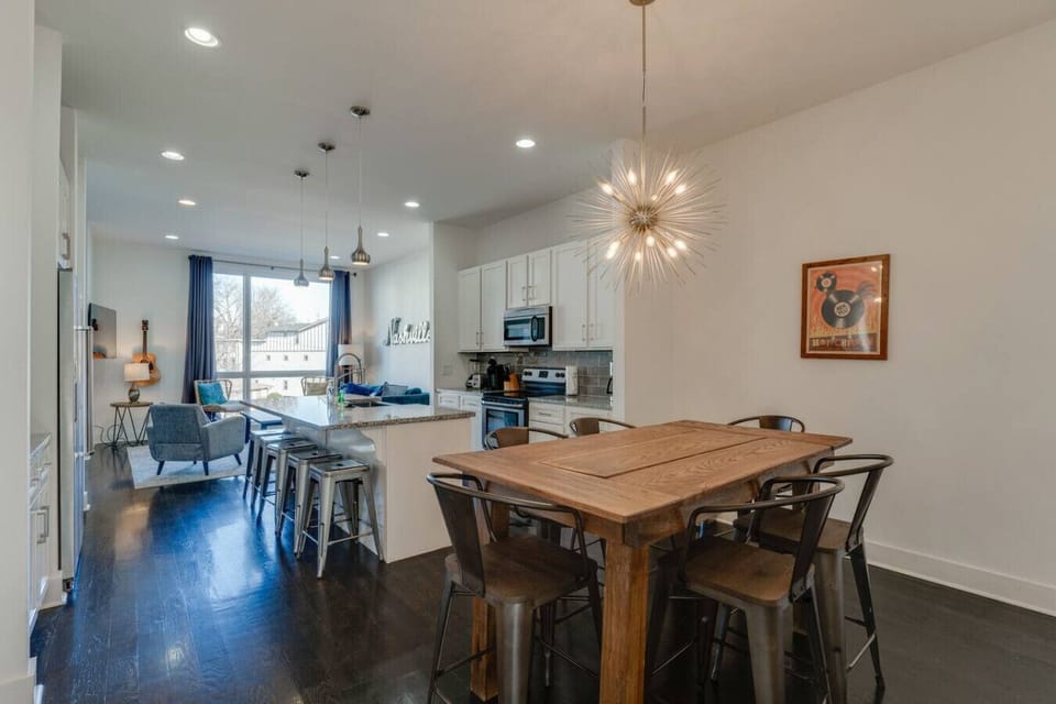 Social Heart of the Home  — Spacious open-concept living and dining, perfect for your large group.