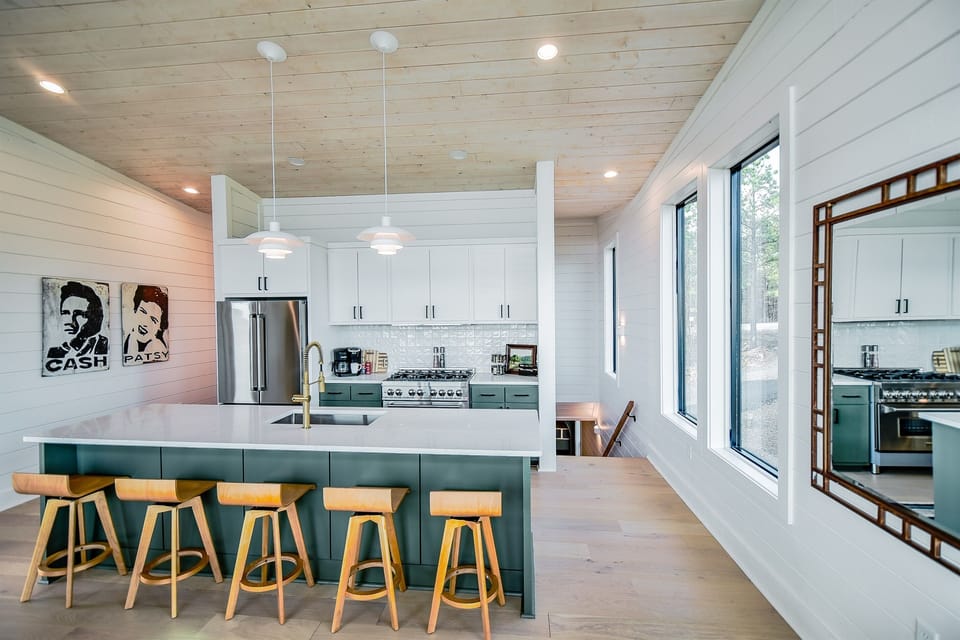 Meals are fun in our open concept chef's kitchen with huge island. Gas stove, tons of seating and room to lounge.