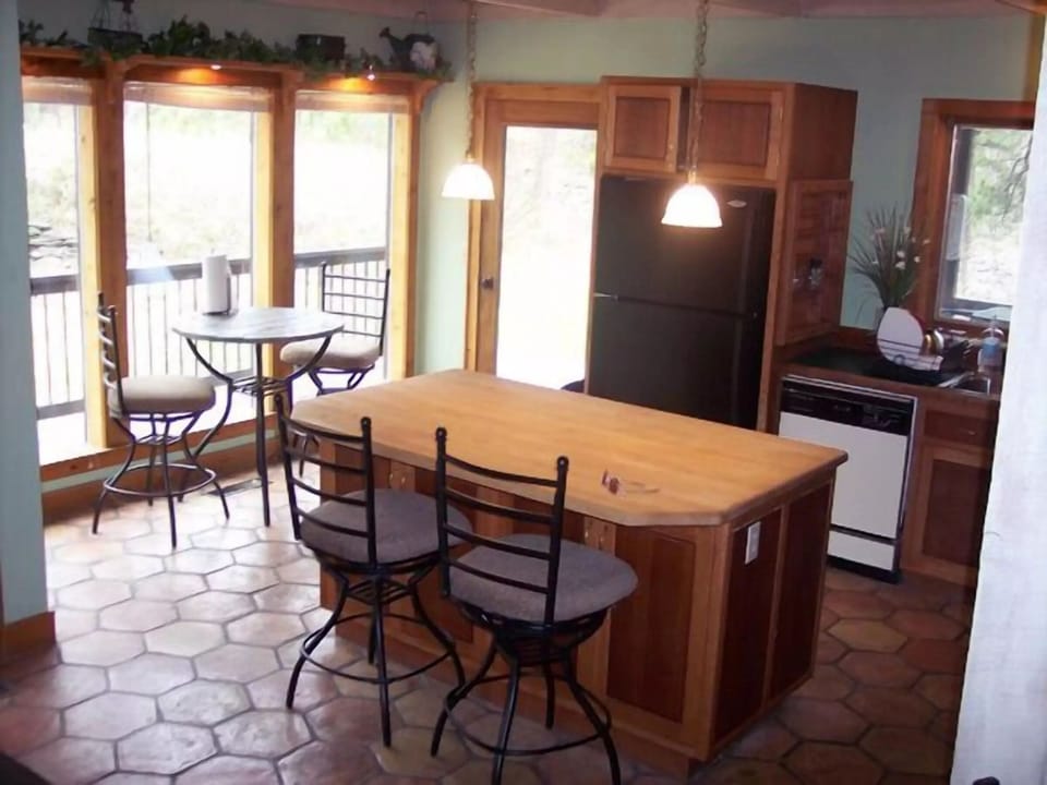 The kitchen surrounded by windows